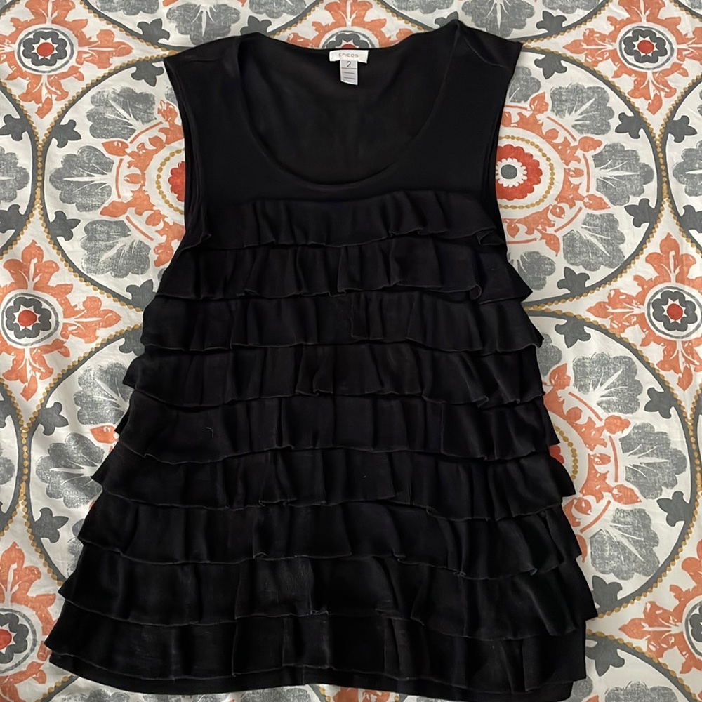 Fun black tank top with ruffles.